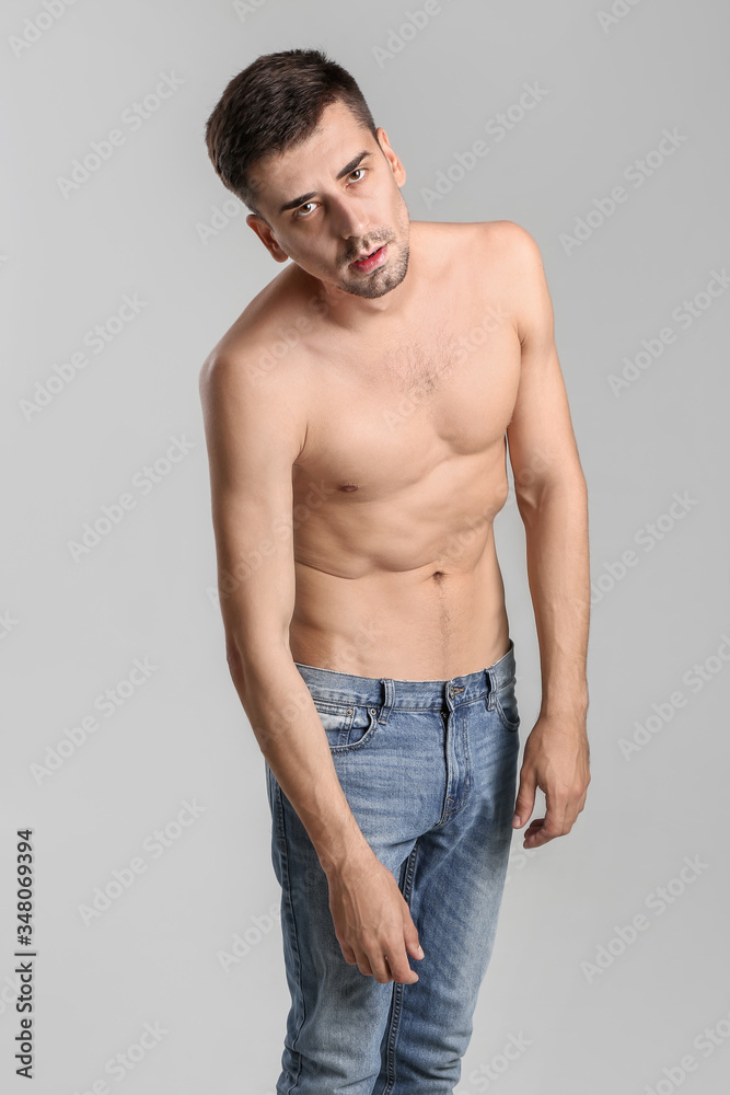 Young man with anorexia on grey background Young man with anorexia on grey background