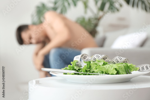 Young man suffering from an...