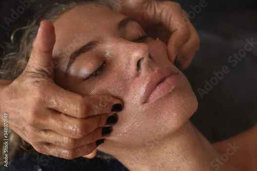 Spa Face Massage. Skin Care Beauty Treatment For Woman. Beautician Massaging Female Face. Relaxed Model On Natural Cosmetics Procedure.