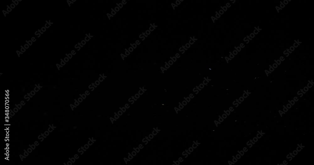 Dust particles floating in air in the dark Dust particles floating in air in the dark