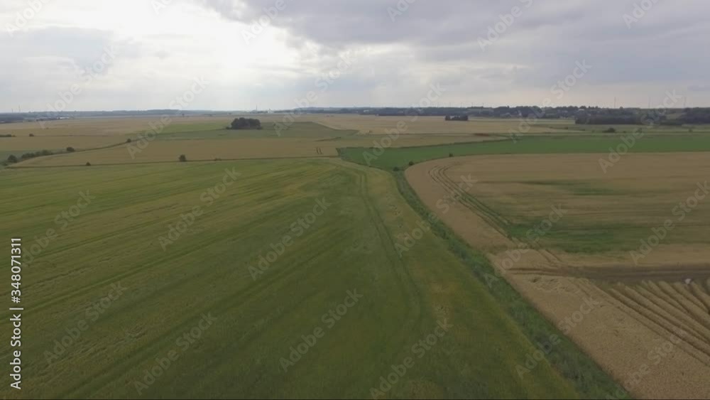Aerial video of green and yellow fields in the summer. Aerial video of green and yellow fields in the summer.