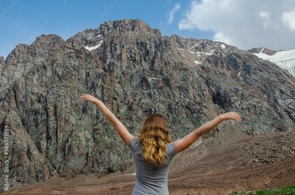 beautiful girl close-up on a background of high mountains beautiful girl close-up on a background of high mountains