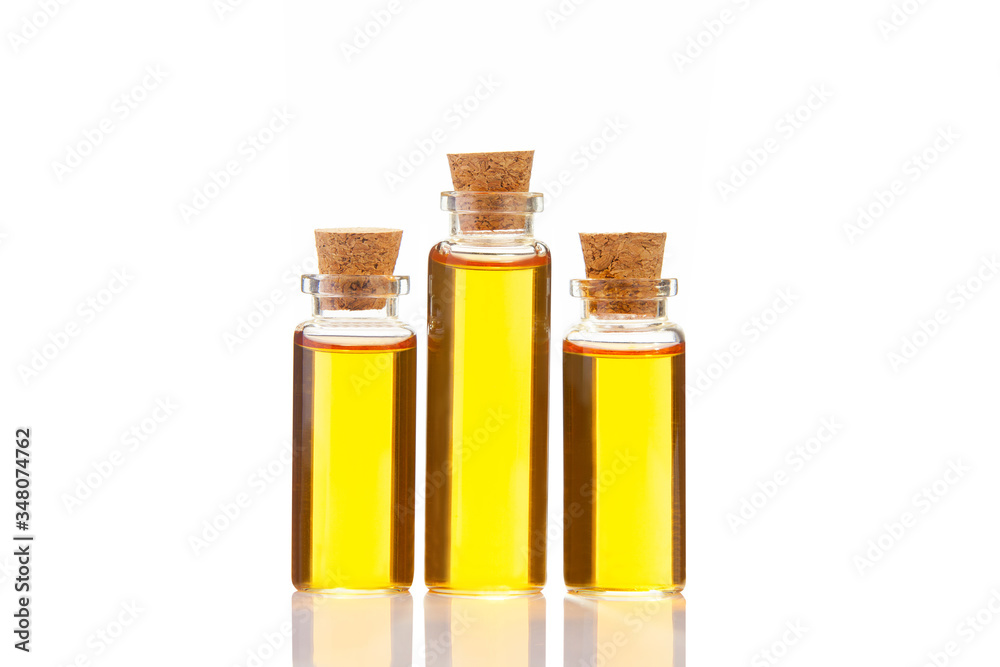 Essence of flowers on white background in beautiful glass Bottle Essence of flowers on white background in beautiful glass Bottle