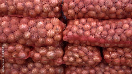 natural onions in the nets on the market