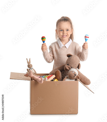 Little girl with toys on wh...
