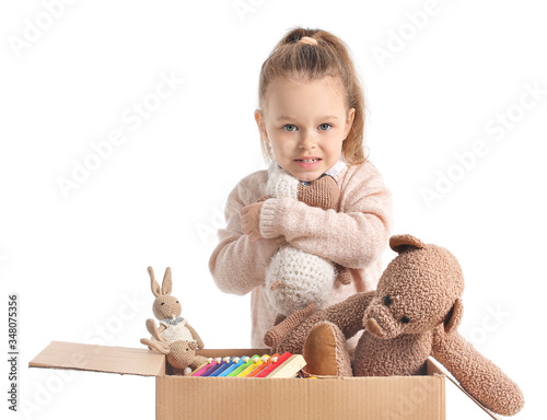 Little girl with toys on wh...