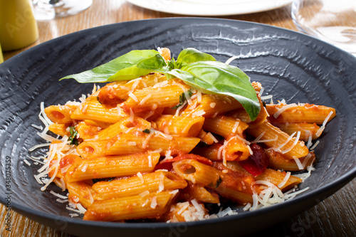 Pasta penne Napoli, traditional italian. Penne al'arrabiata (pasta with a spicy tomato sauce)