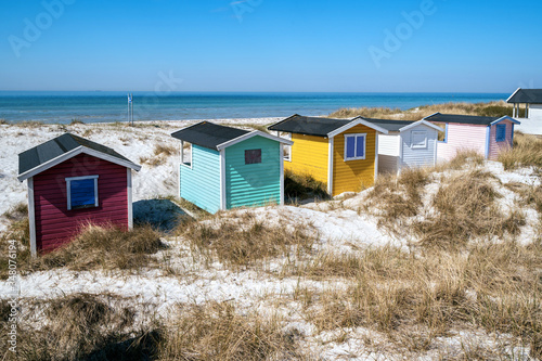 Candy coloured beach hut on Skanor beach in Falsterbo, Skane, Sweden. Swedish tourism concept photo