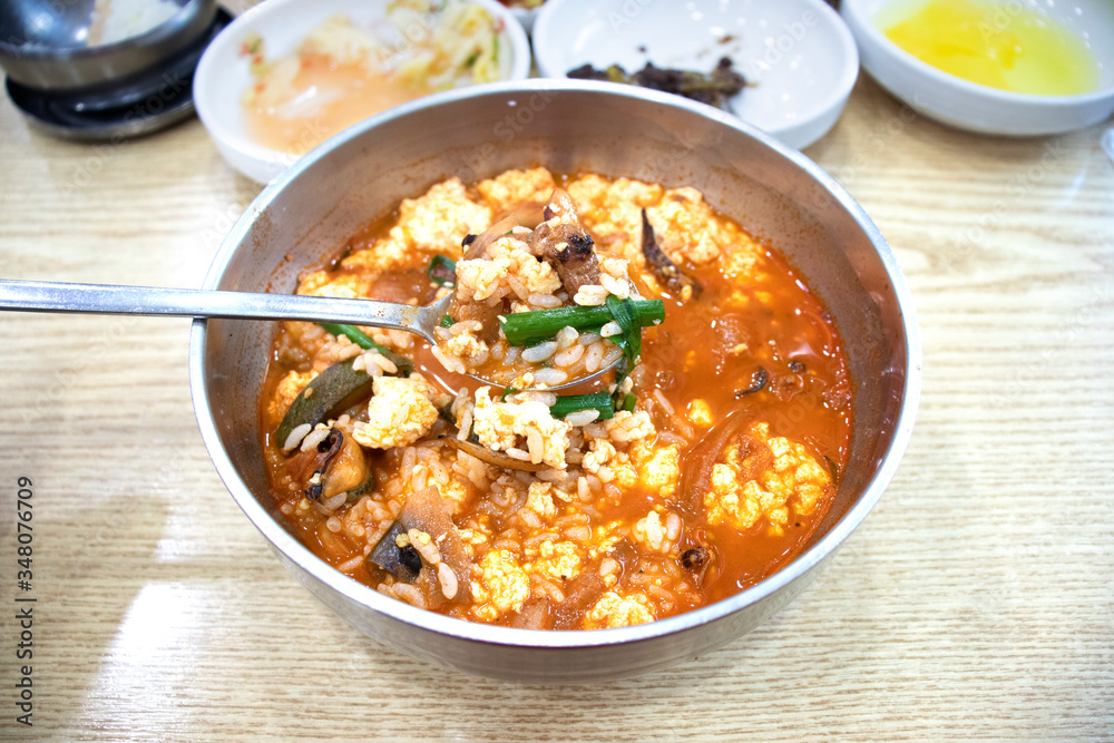 Spicy soup with soft tofu and seafood, Chinese style spicy soup. Spicy tofu soup. Spicy soup with soft tofu and seafood, Chinese style spicy soup. Spicy tofu soup.