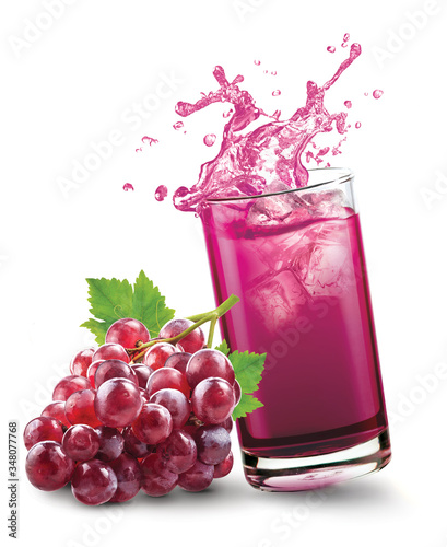 Fotografie Glass of splashing grape juice with grape fruit on white background