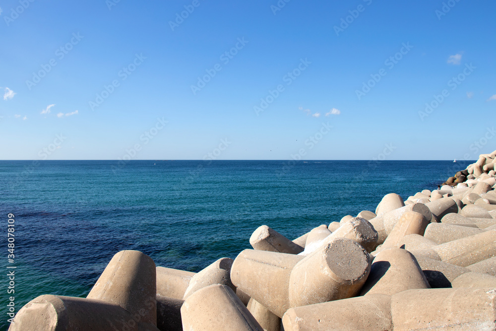 Beautiful sky and blue ocean. Sea scape. breakwater Beautiful sky and blue ocean. Sea scape. breakwater