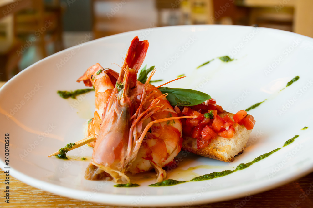 Shrimp, bruschetta with tomatoes, garlic and fresh basil