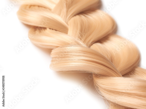 Beautiful braided blonde hair on white background, closeup
