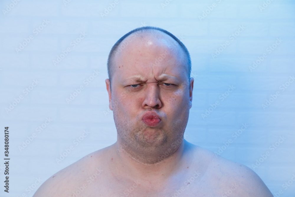 Portrait of a bald man who made a face. Portrait of a bald man who made a face.