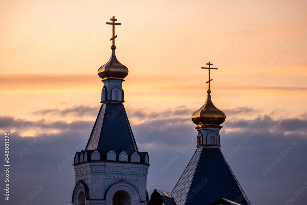 two towers of the Orthodox Church against the sky in the evening