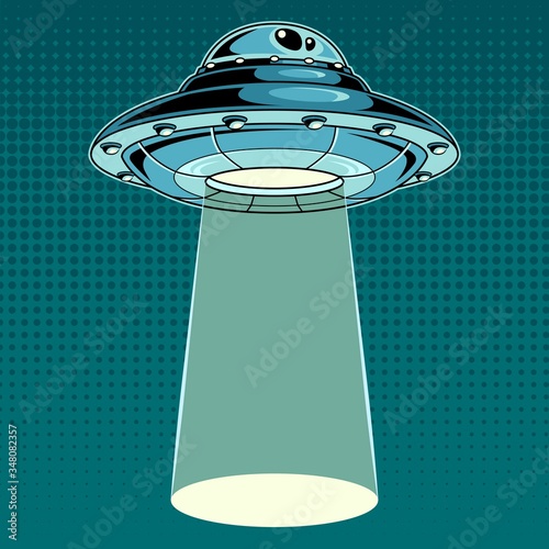 UFO with a ray of light. Vintage pop art vector illustration.