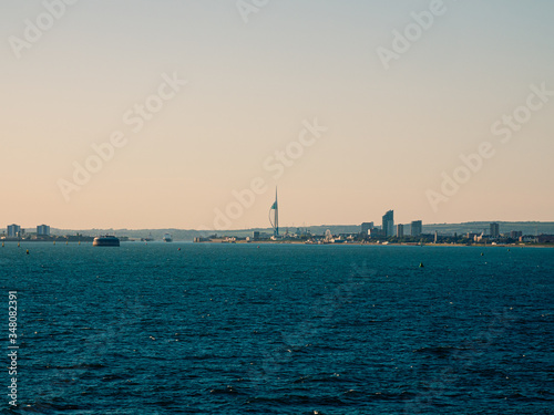 Panoramic view on the buildings of Portsmouth from the cruise ship in ocean