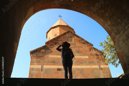 Silhouette of a Female Traveler Impressed with the Church of Holy Mother of God in Khor Virap Monastery in Ararat Province of Armenia photo