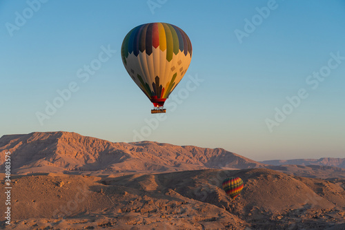 Hot air Balloons over Valley of the King in Luxor city in a morning sunrise, Upper Egypt