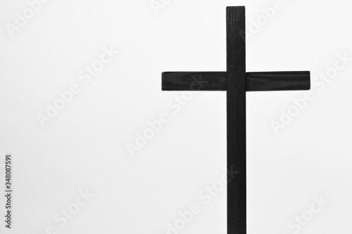 Fotobehang Crucifix is a monochrome isolated image of a dark holy cross with a white background