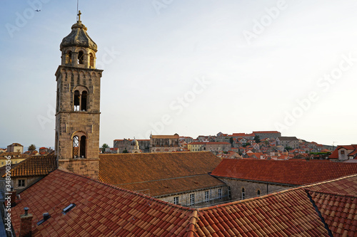 Exterior architecture and design of Dubrovnik old town city walls and landscape with clear blue sky, southern Croatia fronting the Adriatic sea encircled with massive stone