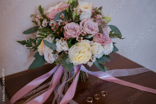 wedding gold rings with a bouquet of the bride