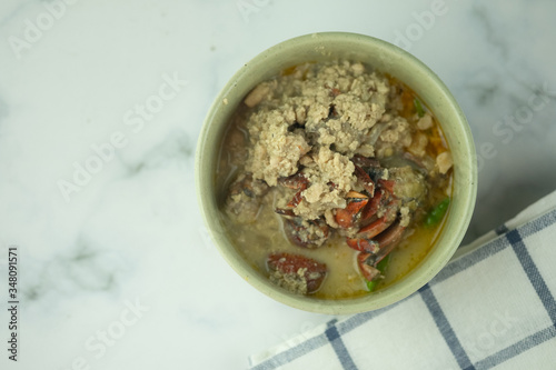 Top view of delicious Tao Jiaw Lone (Herbed soya beans with minced pork and crab in coconut milk photo