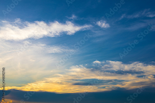 Dramatic sky with cloud at sunset for background wallpaper. © Chaiwat