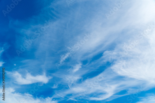 White clouds against a blue sky, copy space. Cloudy sky in clear weather. Cumulus cloud on a sunny winter day.