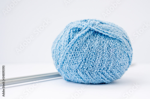 Yarn for knitting and knitting needles, materials for needlework. Background for training or ads. Background for Hobbies and creativity. Leisure and recreation. Life in quarantine.