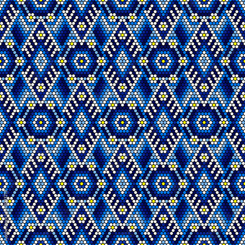 vector illustration of geometric seamless pattern inspired in mexican handmade huichol crafts style. Can be tiled