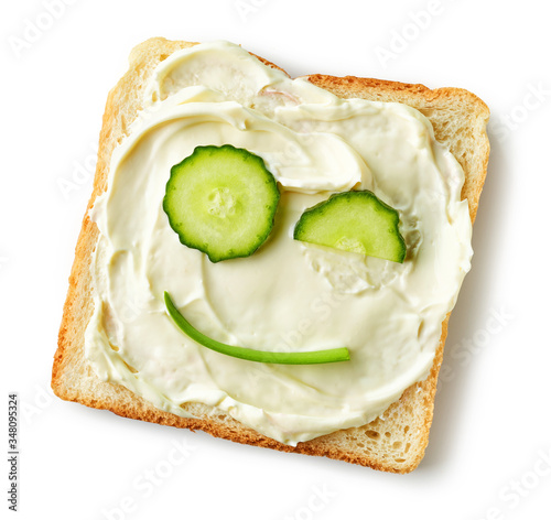 toasted bread with cream cheese and cucumber photo