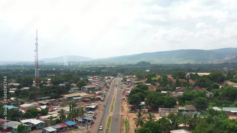 Aerial view of town settlement road in africa with vehicles