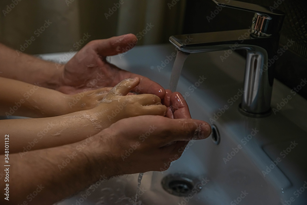 washing hands with soap. Washing a child’s hands with soap and water to prevent coronavirus and hygiene to stop the spread of coronavirus. wash your hands with soap and hot water washing hands with soap. Washing a child’s hands with soap and water to prevent coronavirus and hygiene to stop the spread of coronavirus. wash your hands with soap and hot water