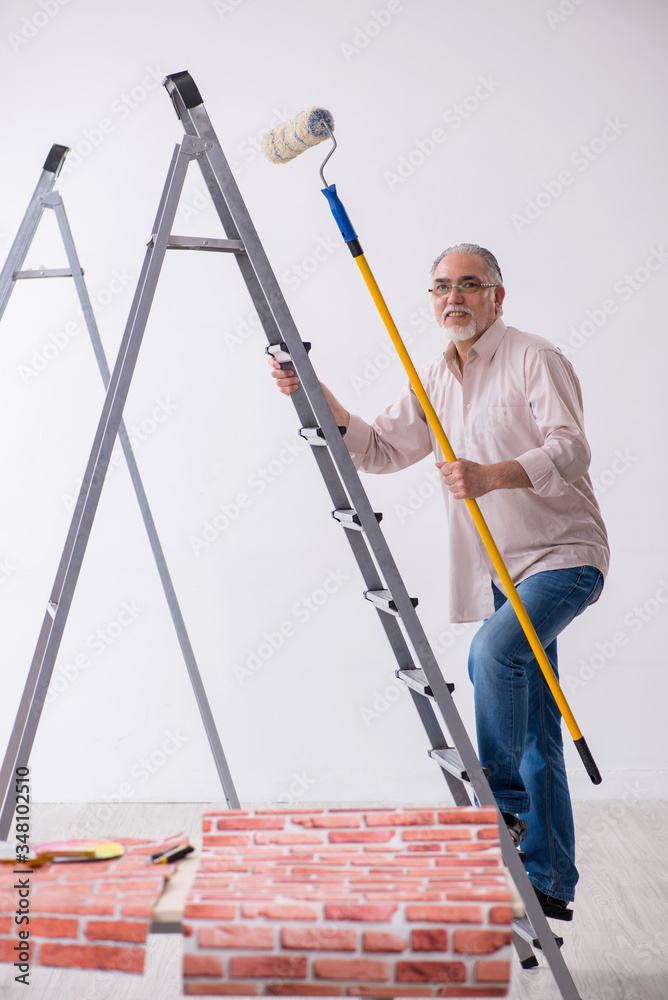 Old husband contractor in home renovation concept Old husband contractor in home renovation concept
