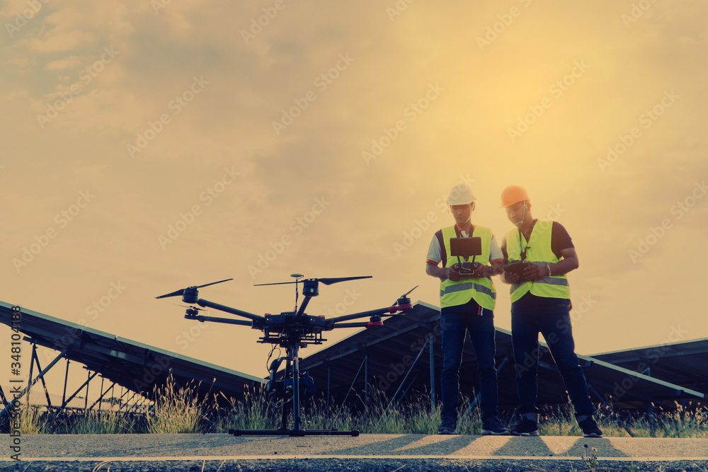 Engineer inspect and checking solar panel by Drone at solar power plant ...