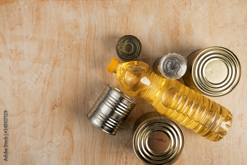 long-term storage products for grocery for donation on a light wooden background