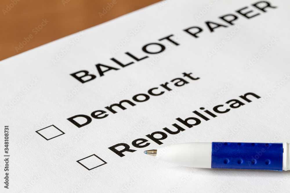 Checklist concept. Closeup of ballot paper with words Democrat and Republican with checkboxes and pen on it.