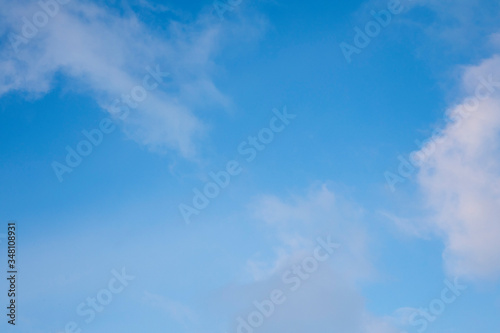 Beautiful white Cirrus clouds in a blue sky. Background and texture of the sky