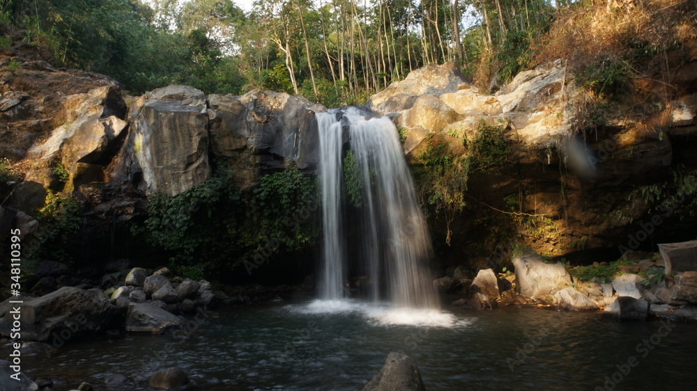 Fototapeta premium beautiful waterfall in the middle of the forest in central java, indonesia