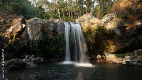 beautiful waterfall in the middle of the forest in central java  indonesia