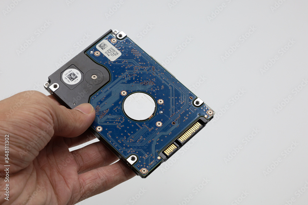 Hard disk isolated on a white background. Computer HDD Hard Disk Drive. Computer Storage Memory. Solid State Drive.
Hard disk isolated on a white background. Computer HDD Hard Disk Drive. Computer Storage Memory. Solid State Drive.