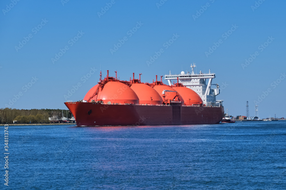 LNG or liquified natural gas tanker enter port on a sunny day in Klaipeda, Lithuania. Alternative gas supply, commercial freight, energy crisis LNG or liquified natural gas tanker enter port on a sunny day in Klaipeda, Lithuania. Alternative gas supply, commercial freight, energy crisis