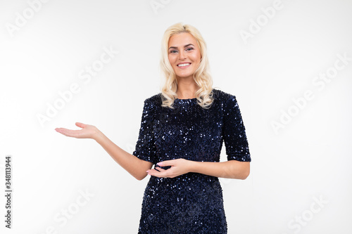 girl in elegant shiny dress with holding hands on a white studio background