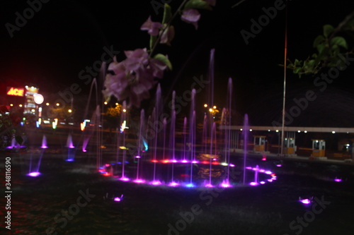 Batam, Indonesia – March 17, 2020: A fountain lights that illuminate a calm and quiet night, Batam Island, Indonesia on March 17, 2020“.