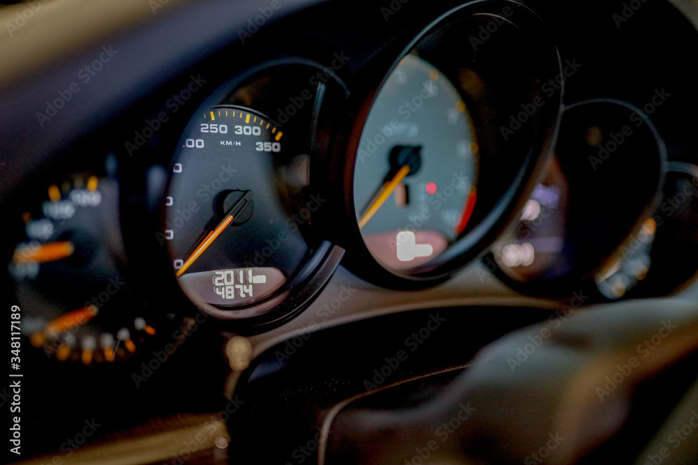 speedometer close up of a black Porsche GT3