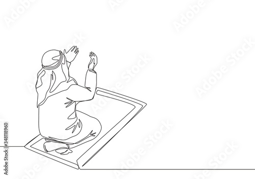 One continuous line drawing of muslim person raise and open hands praying on sajadah, from rear view. Islamic Ramadan Kareem and Eid Mubarak pray concept single line draw design vector illustration