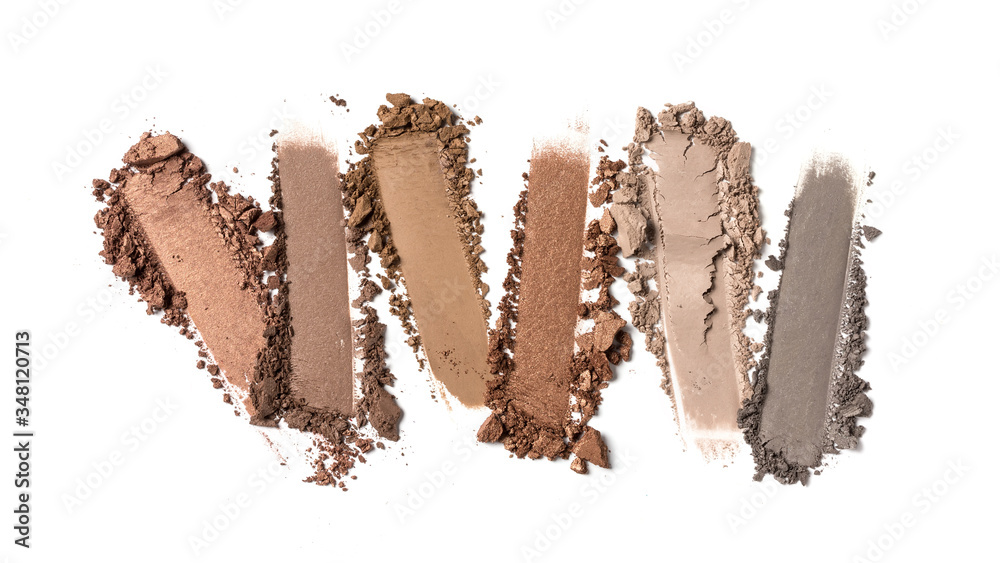 Close-up of make-up swatches. Smears of crushed brown and gray eye shadow Close-up of make-up swatches. Smears of crushed brown and gray eye shadow