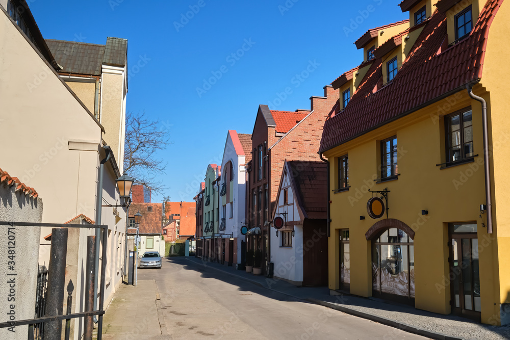 Cobbled pavements of old town streets in Klaipeda, Lithuania on sunny day. Old buildings, houses, galleries, shops, restaurants