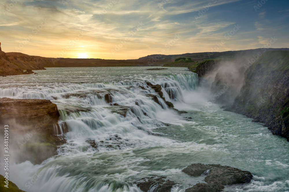 Morning sunrise at Gullfoss Falls Is a popular tourist destination on the Golden Circle route in Iceland. Dramatic dark tones.